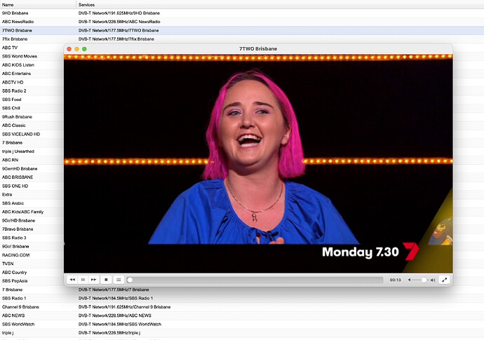Tvheadend's Web UI in the background, VLC in front.